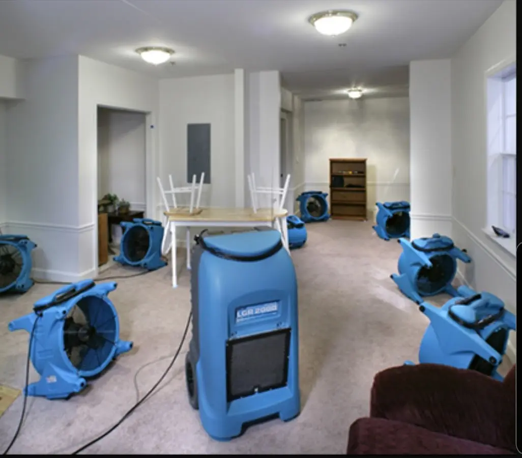 Air movers and dehumidifier setup for Water Damage Restoration in Baxter Village